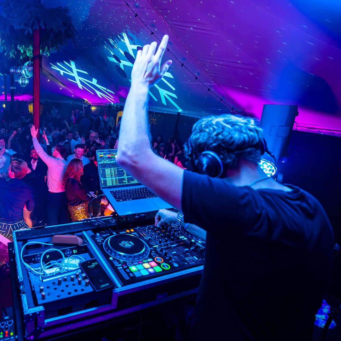 DJ booth setup with mixer and lighting for wedding hire